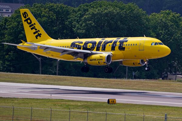 FILE - A Spirit Airlines 319 Airbus lands at Manchester Boston Regional Airport on June 2, 2023, in Manchester, N.H. (AP Photo/Charles Krupa, File)