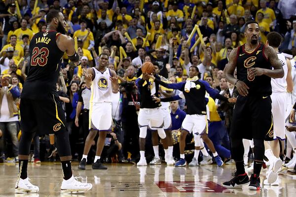 Cleveland's LeBron James (23) questions teammate JR Smith's actions as time expired in regulation against the Golden State Warriors  in Game 1 of the 2018 NBA Finals May 31, 2018, at ORACLE Arena in Oakland, Calif.