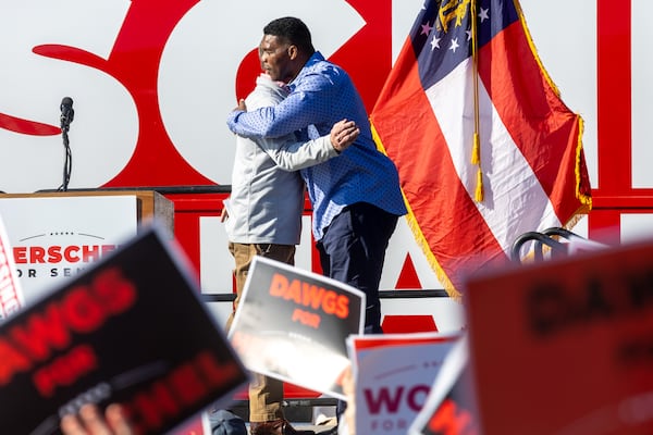 Gov. Brian Kemp (left)  and Republican U.S. Senate hopeful Herschel Walker embrace during a rally in Smyrna Saturday, November 19, 2022.   (Steve Schaefer/steve.schaefer@ajc.com)