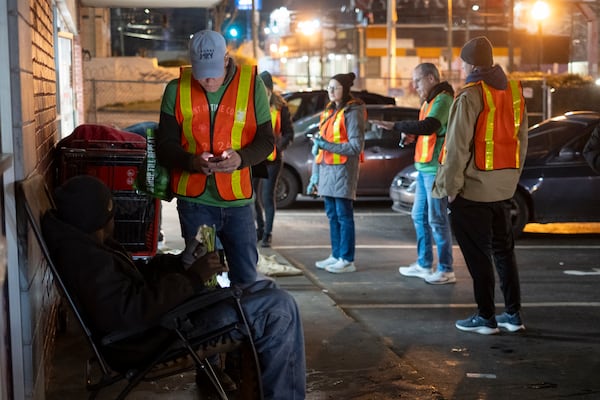 Volunteers participate in a "Point in Time Count” of people experiencing homelessness in Atlanta on Monday, Jan. 22, 2024. (Ben Gray for the AJC)