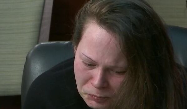 Cortney Bell cries while listening to testimony Wednesday in the Newton County courthouse.