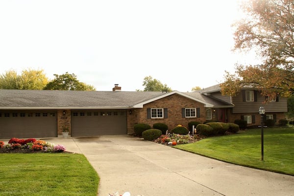 The 4-bedroom house sits on a corner lot with a concrete driveway that leads up to the two 2-car garages both having rear service doors. CONTRIBUTED PHOTOS BY KATHY TYLER