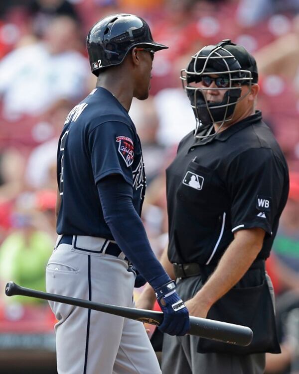 Atlanta Braves' B.J. Upton comments on a called third strike by home plate umpire Mark Carlson in the ninth inning of a baseball game against the Cincinnati Reds, Sunday, Aug. 24, 2014, in Cincinnati. Cincinnati won 5-3. (AP Photo/Al Behrman) B.J. Upton can't believe he struck out. Because he never strikes out. (Al Behrman/AP)