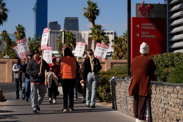 Members of the Culinary Workers Union picket in front of the Virgin Hotels Las Vegas, Friday, Nov. 15, 2024, in Las Vegas. (AP Photo/John Locher)