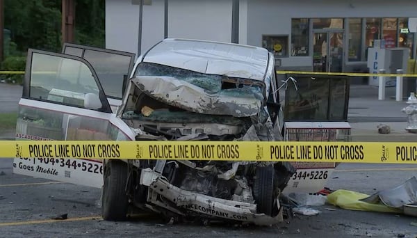 The driver and passenger of the vehicle involved in an accident with a Fulton County school bus had to be extricated and  were taken to a local hospital, Atlanta police said. (Credit: Channel 2 Action News)