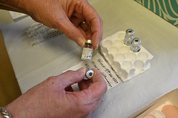 Tina Mewborne, a licensed practical nurse, prepares doses of the Pfizer-BioNTech COVID-19 vaccine last month at the Medical Center of Elberton. The Pfizer vaccine requires two doses. State officials are hoping some logistical problems will be solved with the single-dose Johnson & Johnson vaccine now being reviewed. (Hyosub Shin / Hyosub.Shin@ajc.com)