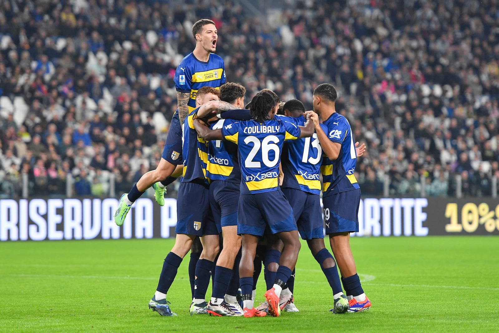 Parma players celebrate after Enrico Delprato scored during the Serie A soccer match between Juventus and Parma at the Allianz Stadium in Turin, Italy, Wednesday, Oct. 30, 2024. (Tano Pecoraro/LaPresse via AP)