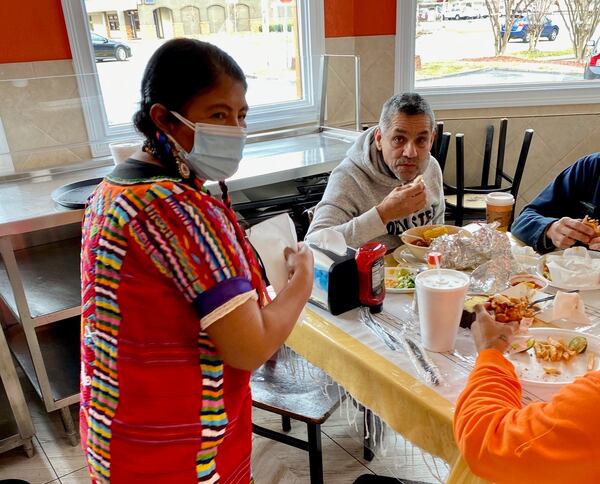 La Oaxaquena’s Rosalia Ruiz opened her restaurant 14 years ago; here, she chats with customers during a busy Thursday lunchtime. Wendell Brock for The Atlanta Journal-Constitution