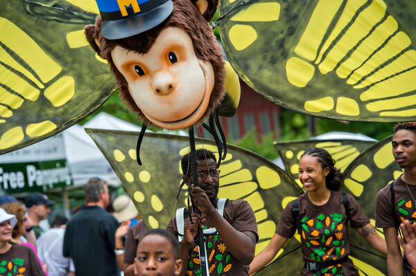 April 25, 2015 Atlanta - Raymond Carr (center) and Alexis Burton participate in the parade during the Inman Park Festival in Atlanta on Saturday, April 25, 2015. The two day festival featured artists, musicians, food, a tour of homes, the parade and activities for children. JONATHAN PHILLIPS / SPECIAL