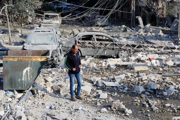 A resident checks the site of an Israeli airstrike in Tyre, southern Lebanon, Saturday, Nov. 9, 2024. (AP Photo/Mohammad Zaatari)