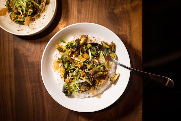 Chef Jarrett Stieber's Winter Vegetables with Rice Porridge, Scallion, Peanut and Korean Chili Flake. Photo credit- Mia Yakel.