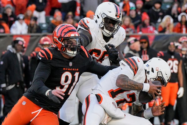 FILE - Cleveland Browns quarterback Dorian Thompson-Robinson (17) is pressured by Cincinnati Bengals defensive end Trey Hendrickson (91) during an NFL football game Sunday, Dec. 22, 2024, in Cincinnati. (AP Photo/Jeff Dean, FIle)