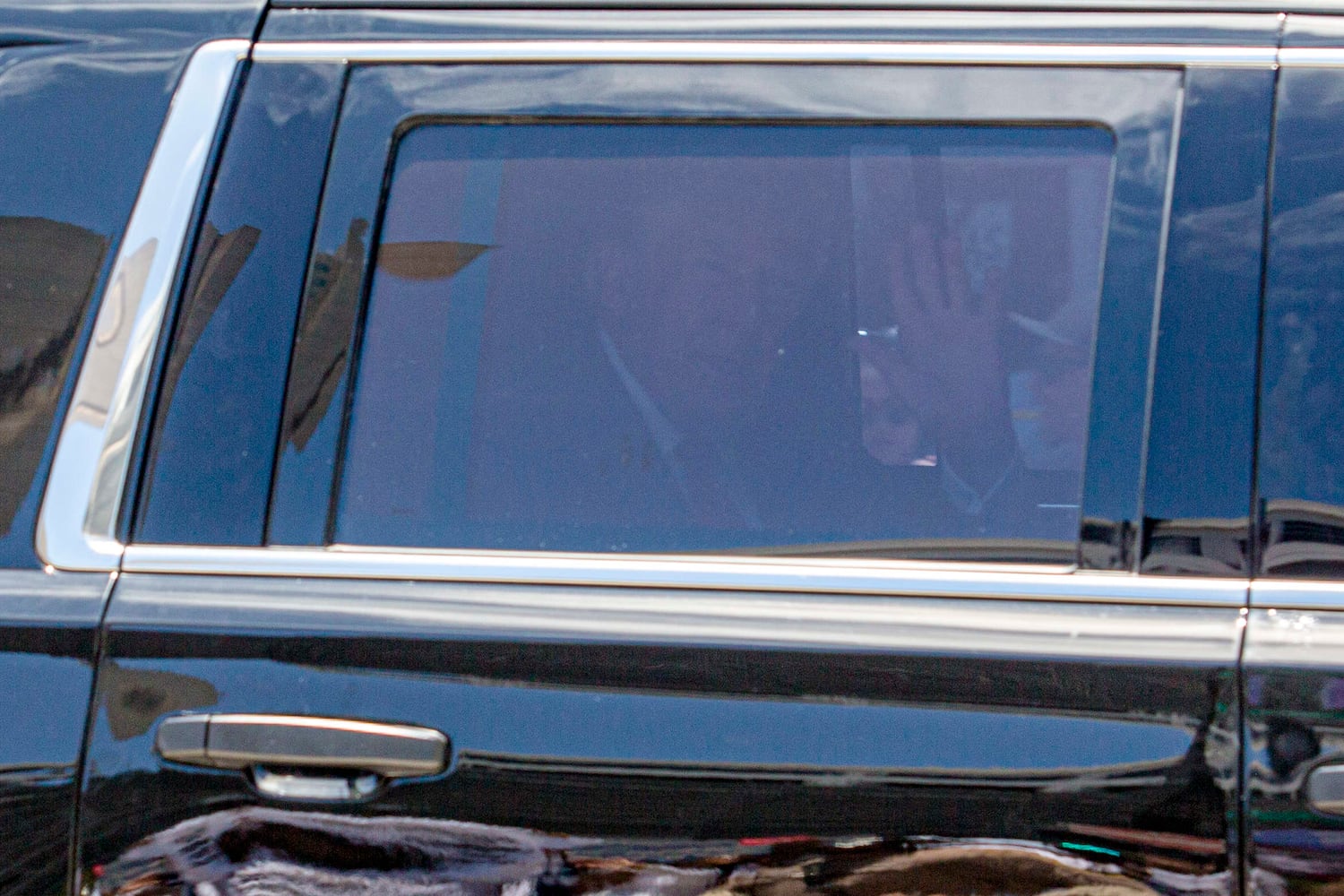 Former President Donald Trump waves as he arrives at the Wilkie D. Ferguson Jr. U.S. Courthouse in Miami, June 13, 2023. (Saul Martinez/The New York Times)