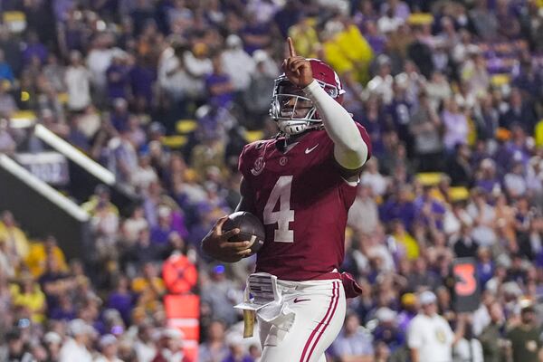 Alabama quarterback Jalen Milroe (4) celebrates a touchdown carry in the second half an NCAA college football game against LSU in Baton Rouge, La., Saturday, Nov. 9, 2024. (AP Photo/Gerald Herbert)