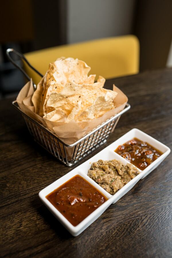 The chutney tasting at Amara has roasted tomato chutney (from left to right), charred eggplant, and mango chutney; and papad. CONTRIBUTED BY MIA YAKEL