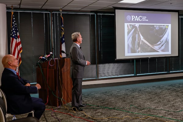 Former Gwinnett District Attorney Daniel J. Porter (right) and Prosecuting Attorneys’ Council of Georgia Executive Director Peter J. Skandalakis (left) discuss video evidence during a press conference announcing the charging decision in the Rayshard Brooks case on Tuesday, August 23, 2022.
