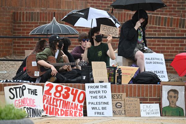 Pro-Palestinian protesters chant at Tate Plaza on University of Georgia campus, Tuesday, April 30, 2024, in Athens.  (Hyosub Shin / AJC)