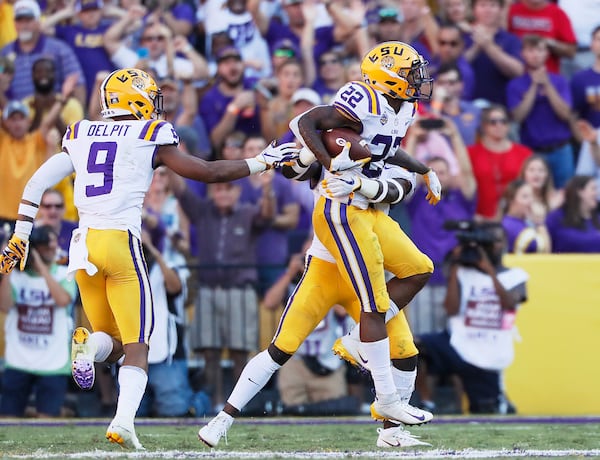 10/13/18 - Baton Rouge -  LSU Tigers cornerback Kristian Fulton (22) celebrates an interception from Georgia Bulldogs quarterback Jake Fromm. The University of Georgia Bulldogs played the Louisiana State University Tigers in a NCAA college football game Saturday, October 13, 2018, at Tiger Stadium in Baton Rouge, LA.    BOB ANDRES / BANDRES@AJC.COM