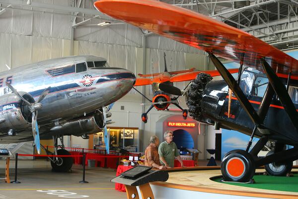 061214 ATLANTA: The Douglas DC-3 Ship 41 (from left to right), and Northeast Airlines Stinson SR-8E Reliant built in 1936, and a restored 1931 Curtiss-Wright 6B Sedan that celebrates the Travel Air that flew Delta's first passengers on June 17, 1929 are on display at the Delta Flight Museum on Thursday, June 12, 2014, in Atlanta. The iconic DC-3's spreed, range and passenger capacity. Ship 41 is the only remaining. Delta passenger DC-3. CURTIS COMPTON / CCOMPTON@AJC.COM