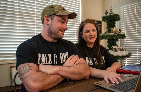 Cobb County school resource Officer Hayden Hurley and his wife, Katelyn, a therapist and master social worker, prepare one of their “Badge & Body” seminars, a trauma and mental health workshop for small law enforcement agencies. During the seminar, Hayden has noticed tiny cracks in the hardened veneer of fellow officers. “Chances are that many officers are feeling the same,” he said. “They just don’t want to be the first to come out and say it.” 

