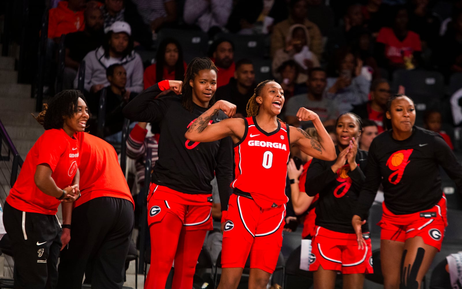 The Bulldogs' bench celebrates a basket Sunday against  Georgia Tech in Atlanta. (CHRISTINA MATACOTTA / FOR THE ATLANTA JOURNAL-CONSTITUTION)