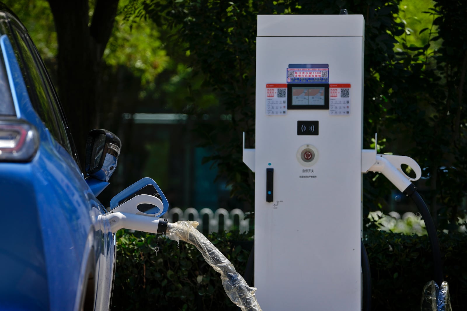 FILE - A Chinese electric vehicle charges in Beijing, Monday, June 24, 2024. (AP Photo/Andy Wong, File)