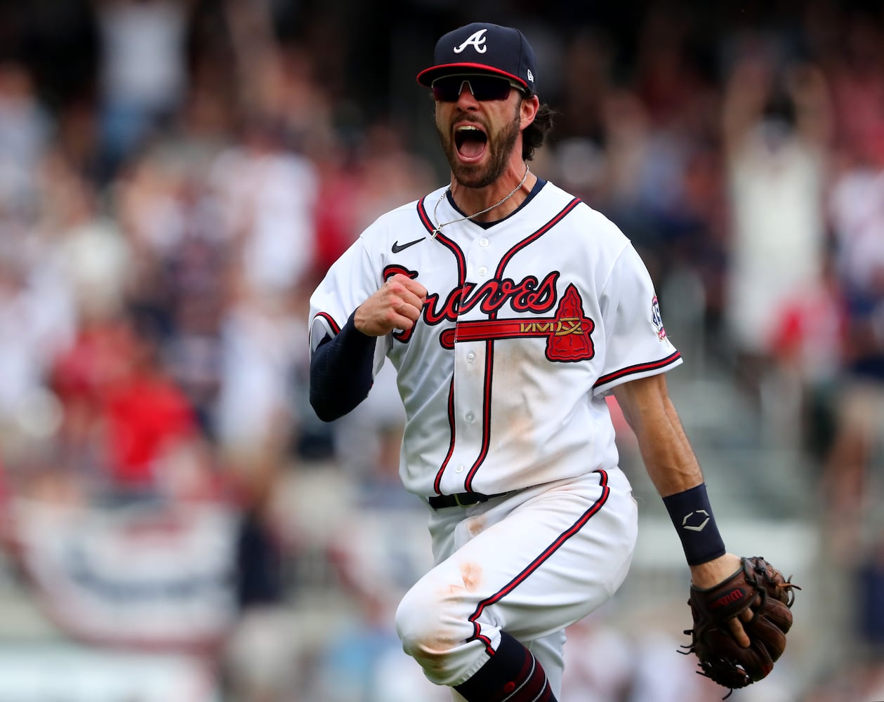 Braves shortstop Dansby Swanson reacts after completing a double play in 2021. Curtis Compton / Curtis.Compton@ajc.com