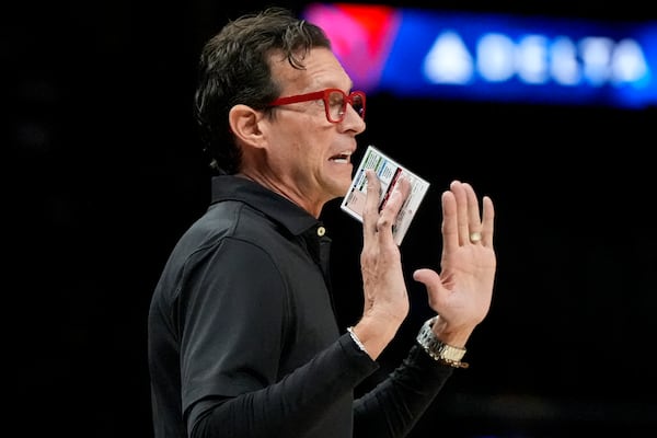 Atlanta Hawks head coach Quin Snyder speaks to his players during the first half of an NBA basketball game against the New Orleans Pelicans, Monday, Dec. 2, 2024, in Atlanta. (AP Photo/Mike Stewart)