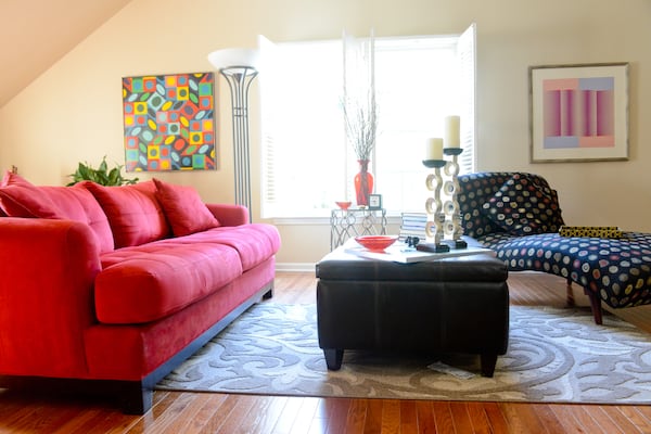 When they bought their townhome, Jeffrey Chandler and Pedro Ayestaran Diaz changed the flooring in the upstairs bonus room from carpet to wood. The wood floors helped transform the space into a spacious and chic sitting area. Text by Lori Johnston and Keith Still/Fast Copy News Service. (Christopher Oquendo Photography/www.ophotography.com)