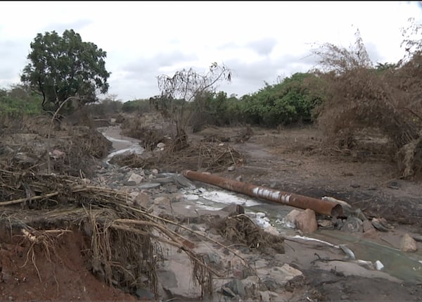 This image taken from video Wednesday, Feb. 19, 2025, shows the path of mine waste in the Mwambashi River, a tributary of the Kafue River, following a tailing dam breach at a Chinese-owned mine near Kitwe, Zambia. (AP Photo/Richard Kille )