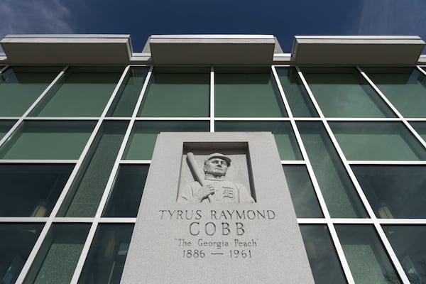 A monument to Ty Cobb stands outside the Royston Public Library. Cobb has always been held up as a symbol of success in his hometown, and his supporters point to good deeds that followed his baseball career, including providing endowments for medical care and education in Georgia. (DAVID BARNES / SPECIAL)