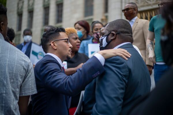 05/14/2021 — Atlanta, Georgia — Atlanta City Councilman Antonio Brown greets a supporter before announcing his bid for Atlanta mayor during a press conference outside of Atlanta City Hall in Atlanta, Friday, May 14, 2021. (Alyssa Pointer / Alyssa.Pointer@ajc.com)