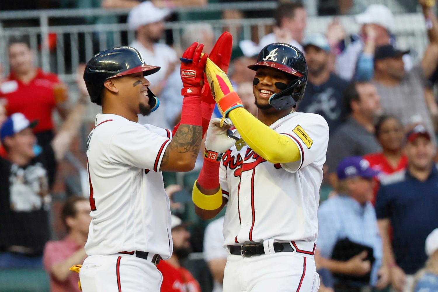 Braves shortstop Orlando Arcia (11) celebrates with right fielder Ronald Acuna Jr. (13) after scoring on a double from second base Ozzie Albies during the second inning against the Colorado Rockies at Truist Park on Thursday, June 15, 2023, in Atlanta.
Miguel Martinez / miguel.martinezjimenez@ajc.com 