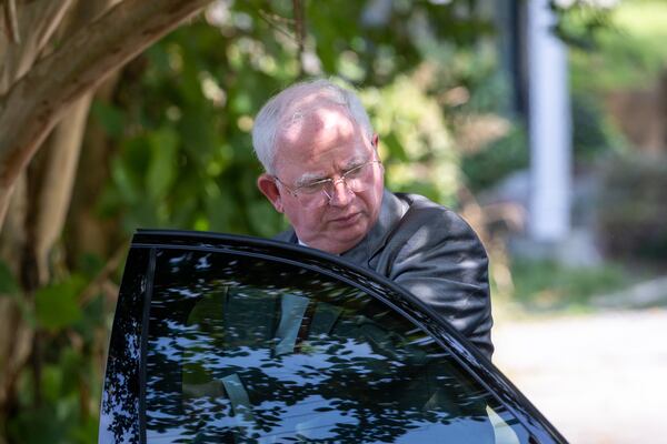 John Eastman, an attorney indicted with former President Donald Trump, leaves his car to make a statement to press outside the Fulton County Jail in Atlanta, where he was booked on Tuesday, August 22, 2023. (Arvin Temkar / arvin.temkar@ajc.com)