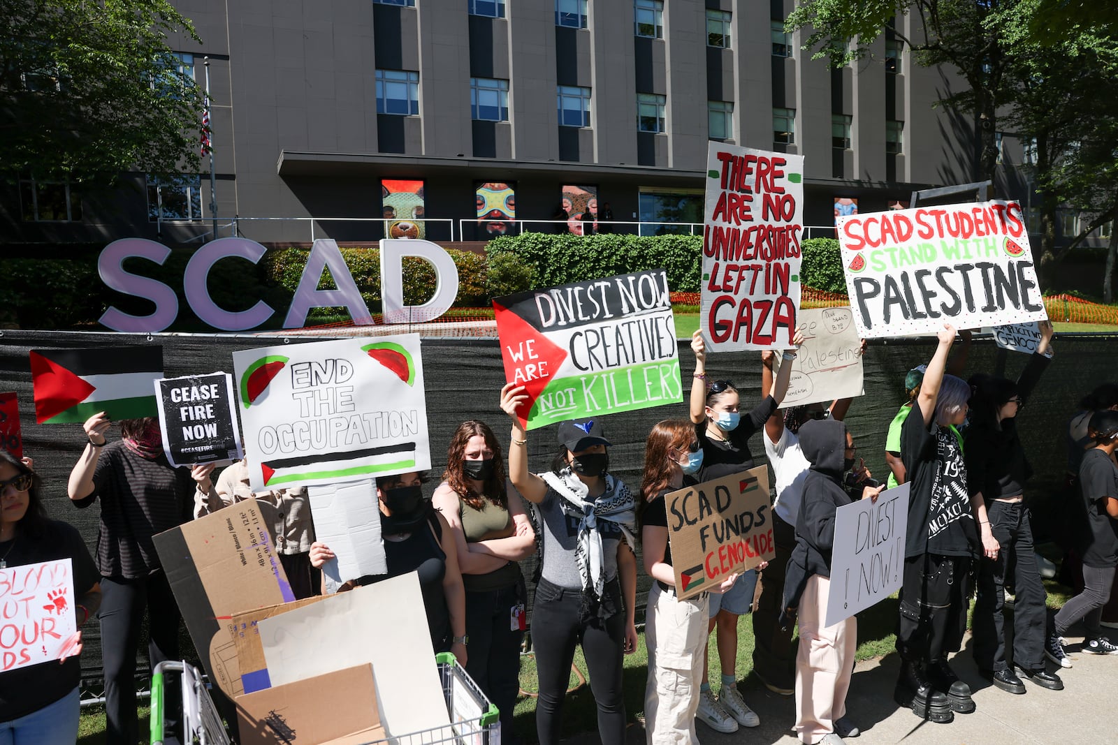 SCAD students hold a walkout for Palestine in front of SCAD on Peachtree Street, Wednesday, May 1, 2024, in Atlanta. SCAD students walked-out of classes in solidarity with Columbia and other university students across the U.S. in support of an immediate cease-fire.  (Jason Getz / AJC)
