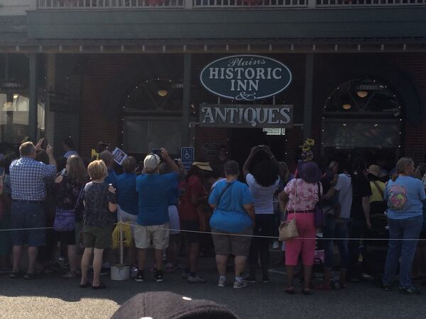 As they waited for the start of the parade during last Saturday's 21st Annual Plains Peanut Festival, the crowd shot photos of Jimmy Carter on the balcony of the Plains Historic Inn. Then they serenaded him with "Happy Birthday." Jill Vejnoska/AJC