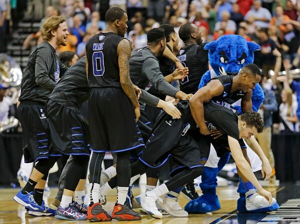 Georgia State players celebrate as they surround R.J. Hunter, right, after he made the game-winning shot against Baylor late in the second half in the second round of the NCAA college basketball tournament, Thursday, March 19, 2015, in Jacksonville, Fla. Georgia State won 57-56. (AP Photo/Chris O'Meara) I wish you could have been here, folks. (Chris O'Meara/AP photo)