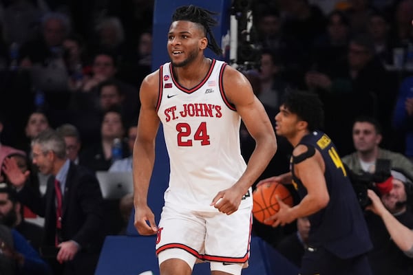 St. John's's Zuby Ejiofor (24) smiles after scoring during the second half of an NCAA college basketball game against the Marquette in the semifinals of the Big East tournament Friday, March 14, 2025, in New York. (AP Photo/Frank Franklin II)