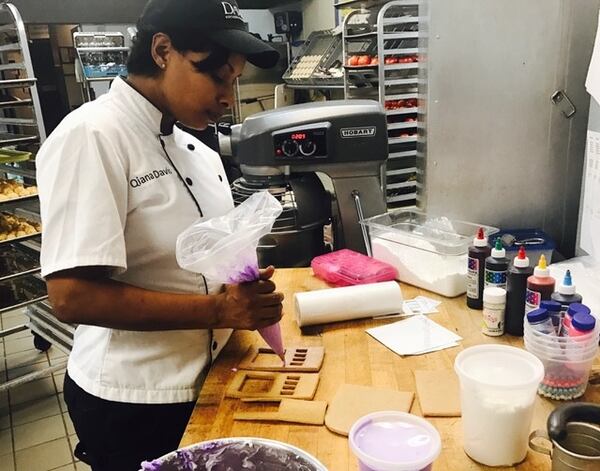 Davio’s Atlanta’s pastry chef Qiana Davis is working on the restaurant’s annual gingerbread display. This year it will be a miniature Phipps Plaza with a little Davio’s and many familiar shops. The windows will come alive each evening as the gingerbread house is lit from the inside by candlelight. (Photo credit: Kina Hollis)