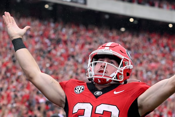 Georgia's running back Cash Jones (32) celebrates after scoring a touchdown during the second half in an NCAA football game at Sanford Stadium, Saturday, September 16, 2023, in Athens. Georgia won 24 - 14 over South Carolina. (Hyosub Shin / Hyosub.Shin@ajc.com)