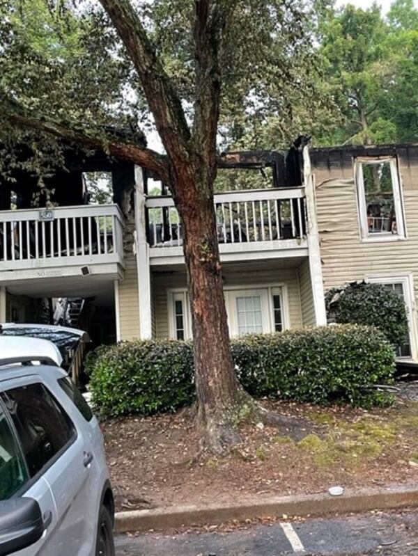 The roof of the apartment building was completely consumed by the fire. 