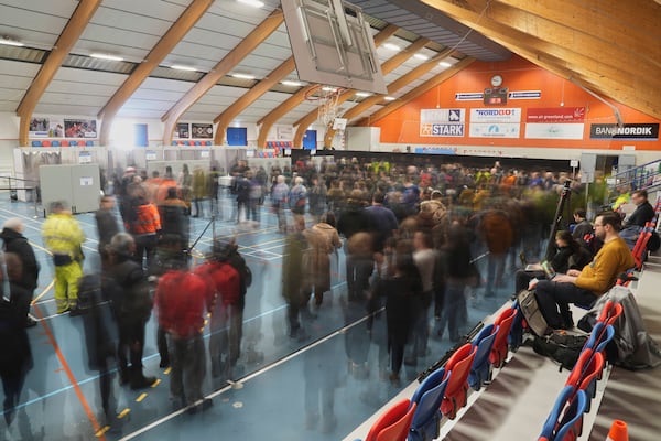 People line up at a polling station to cast their vote in parliamentary elections, in Nuuk, Greenland, Tuesday, March 11, 2025. (AP Photo/Evgeniy Maloletka)