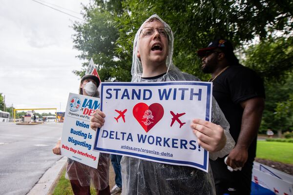 Ryan, a community supporter chants slogans at a Delta airline labor rally near Hartsfield-Jackson International Airport in Atlanta on Wednesday, July 17, 2024.  (Ziyu Julian Zhu / AJC)