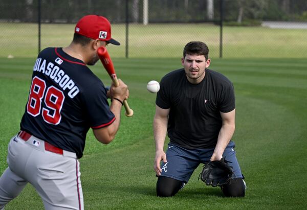 Atlanta Braves third base Austin Riley practices hird base coach Matt Tuiasosopo during spring training workouts at CoolToday Park, Thursday, February 13, 2025, North Port, Florida. (Hyosub Shin / AJC)