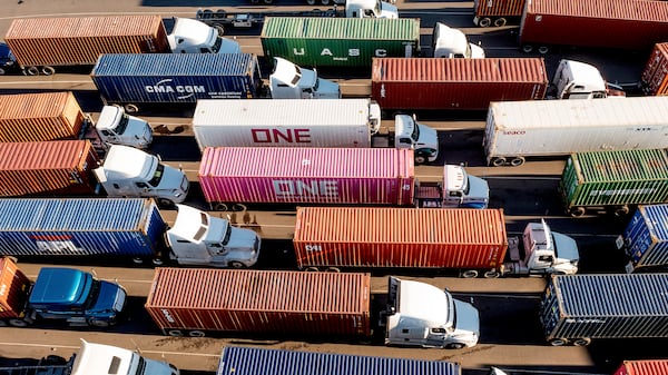 FILE - Trucks line up to enter a Port of Oakland shipping terminal on Nov. 10, 2021, in Oakland, Calif. (AP Photo/Noah Berger, File)