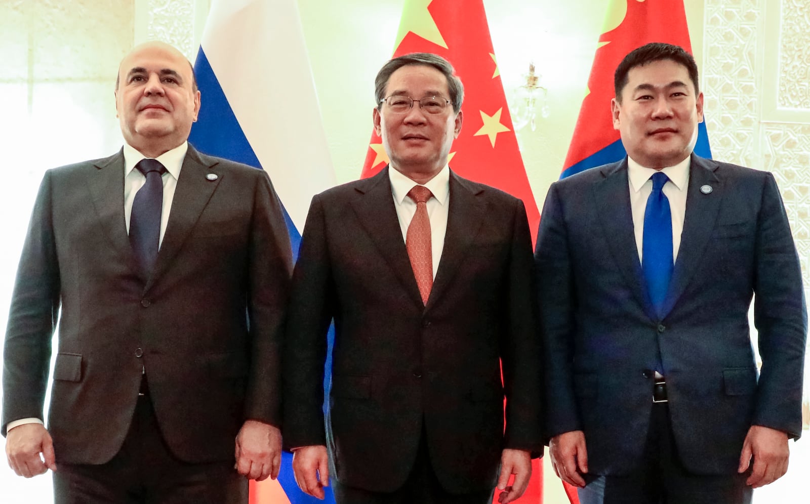 Russian Prime Minister Mikhail Mishustin, left, Chinese Premier Li Qiang, center, and Mongolian Prime Minister Luvsannamsrain Oyun-Erdene pose for a photo on the sidelines of the Shanghai Cooperation Organization (SCO) Council of Heads of Governments Summit in Islamabad, Pakistan, Wednesday, Oct. 16, 2024. (Roman Naumov, Sputnik, Government Pool Photo via AP)