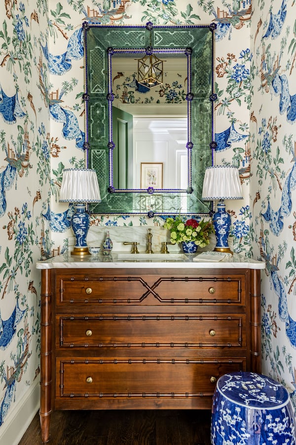 Atlanta interior designer Mallory Mathison Glenn says that details like custom lampshades, painted ceilings and the right wallpaper can help bring a maximalist space like this powder room together. Photo: Courtesy of Mallory Mathison Inc. / Jeff Herr