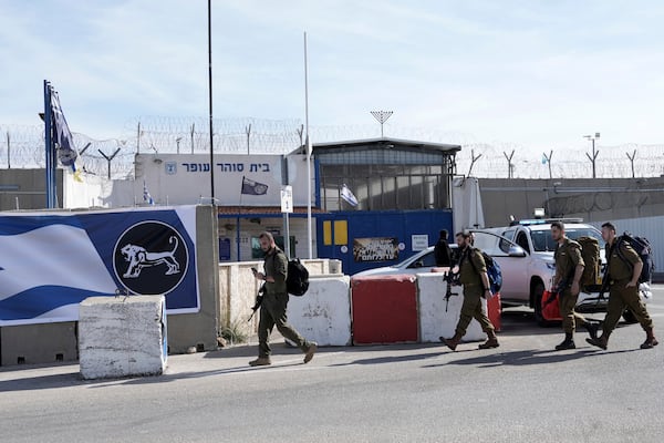 Israeli soldiers walk outside Ofer military prison near Jerusalem on Sunday, Jan. 19, 2025. (AP Photo/Mahmoud Illean)