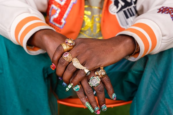 Atlanta rapper Trinidad James poses for a photo inside of his new boutique Hommewrk located inside Underground Atlanta on March 7. (Natrice Miller/AJC)