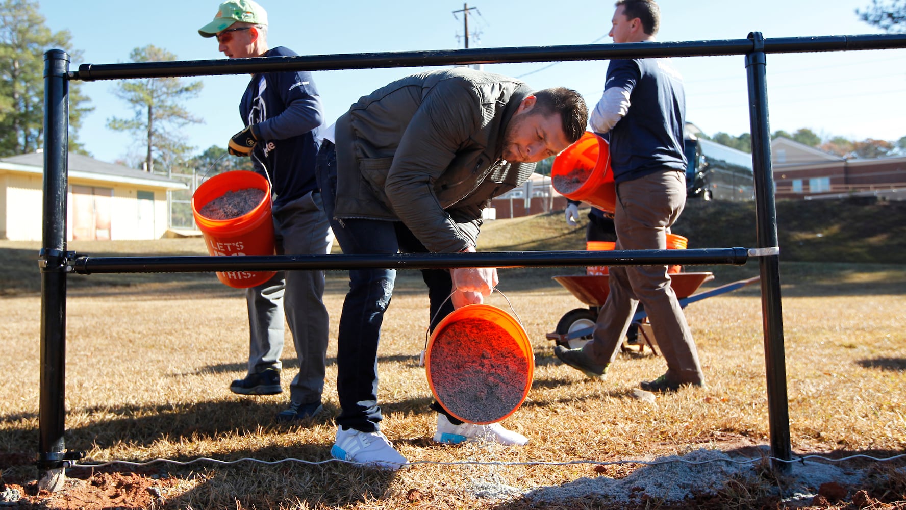 SEC stars build football field in DeKalb